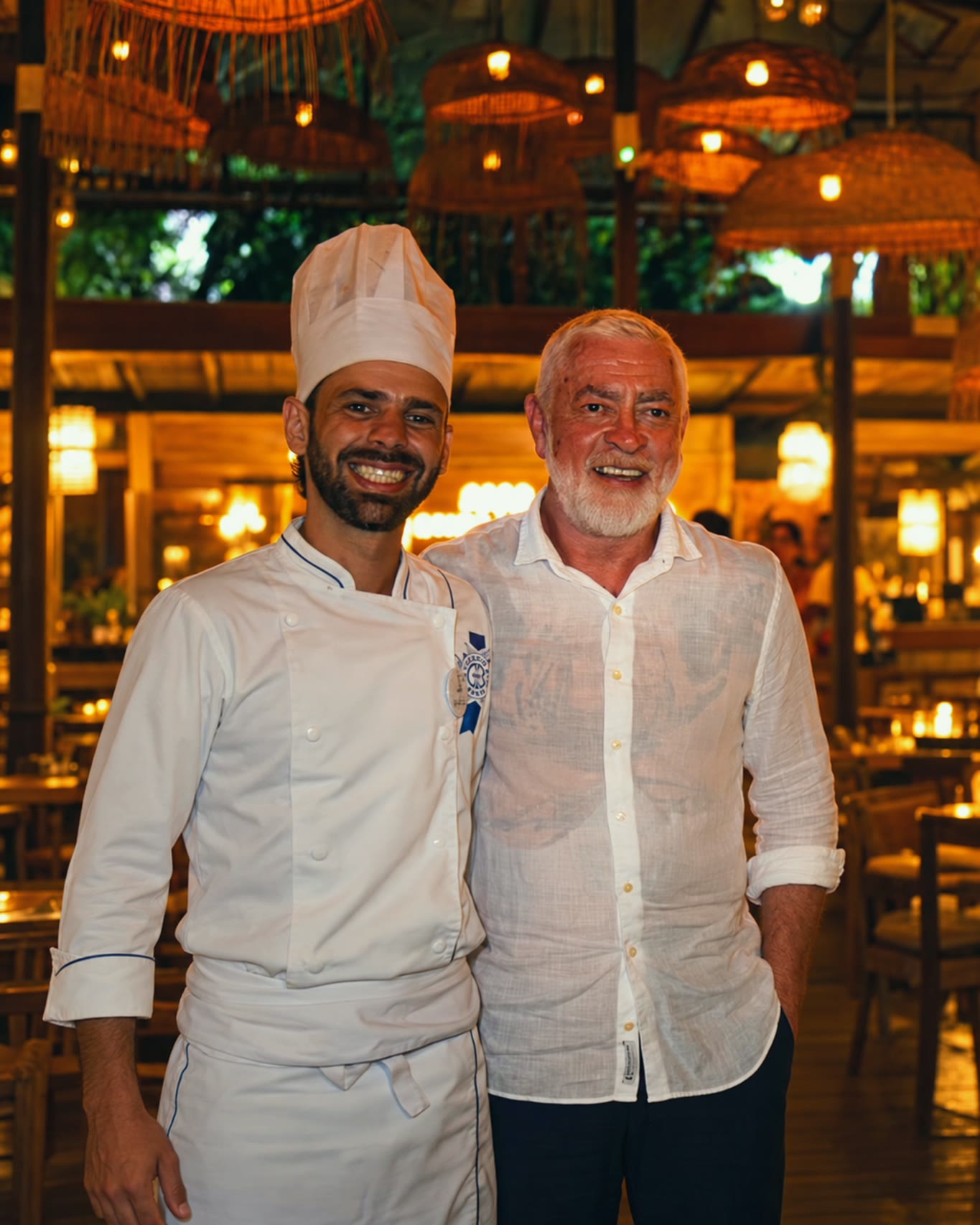Chef Vitor Jover beside the guest chef during the event in Búzios