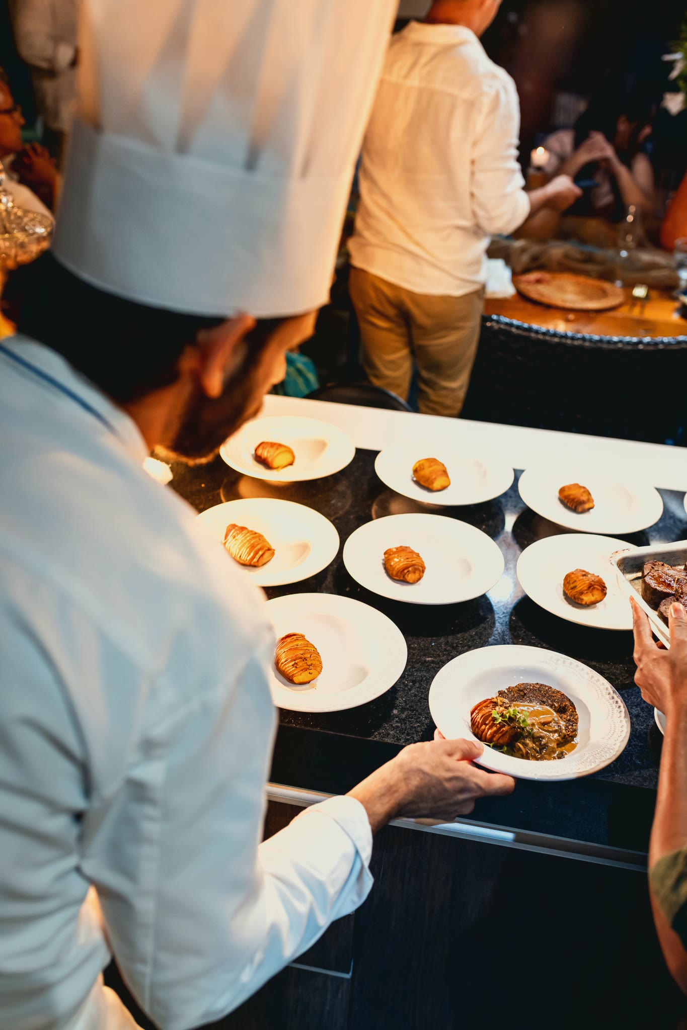 Plates lined up at the pass, before service